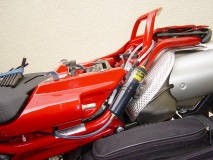 Scottoiler behind rear panel